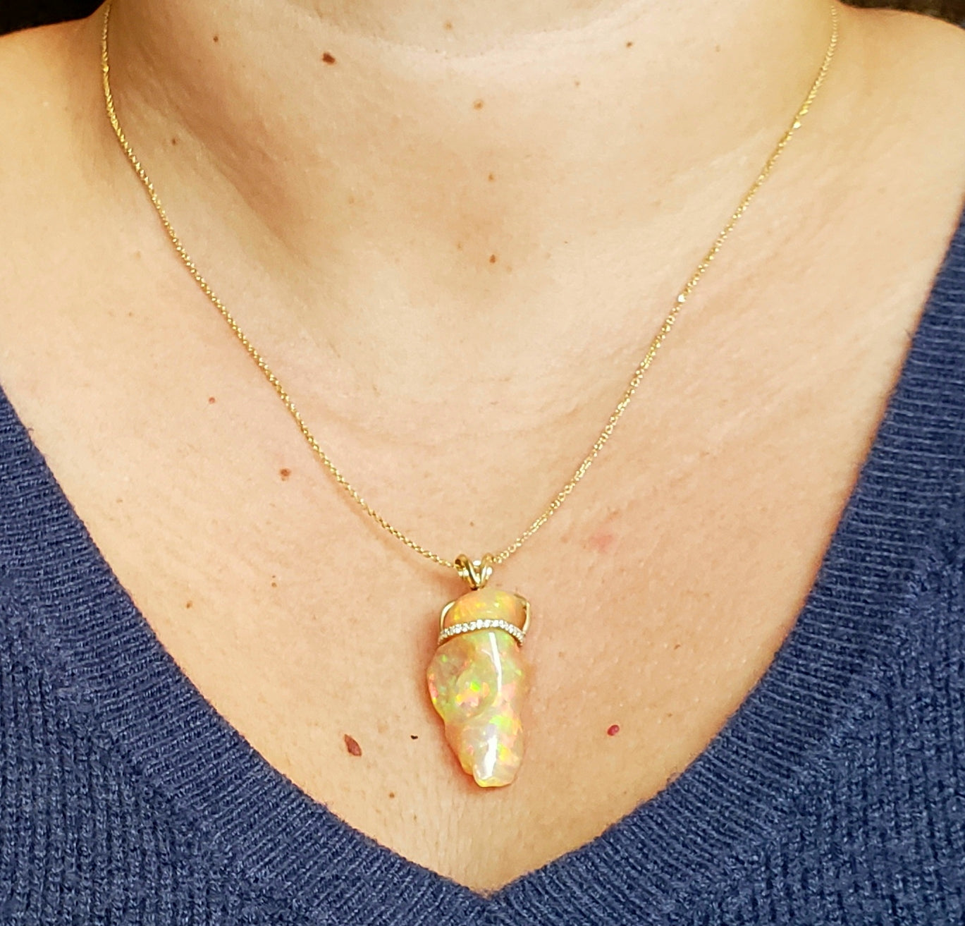 Carved orange opal spinning pendant #101