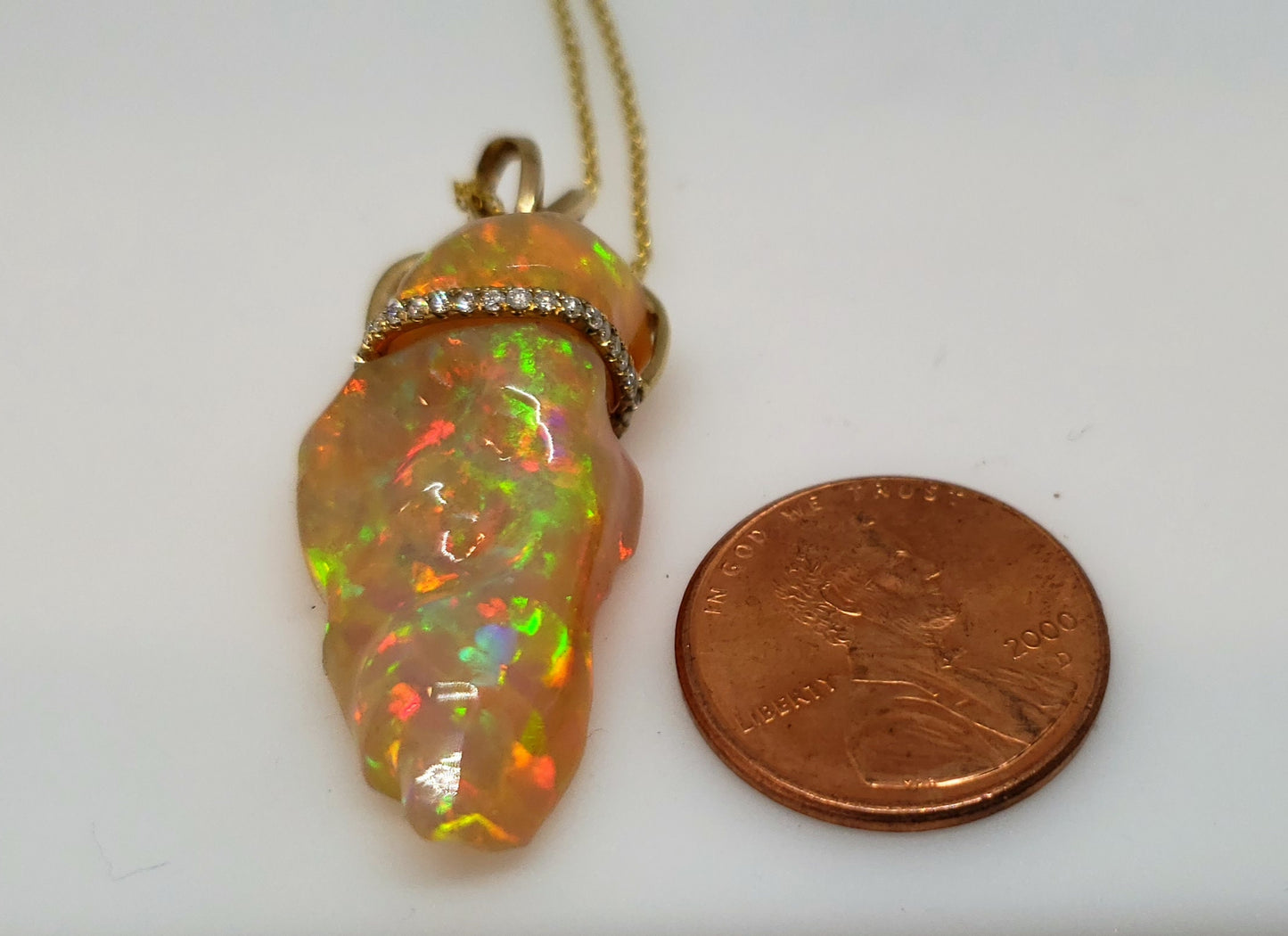 Carved orange opal spinning pendant #101