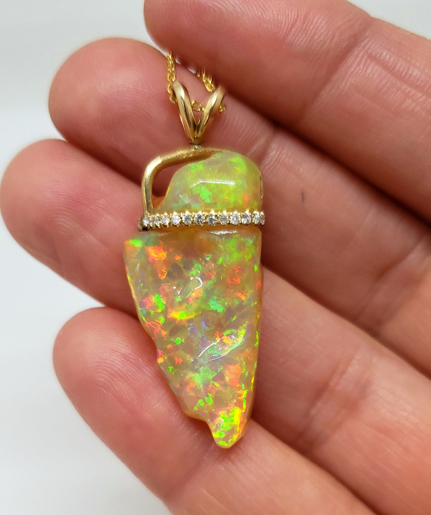 Carved orange opal spinning pendant #101