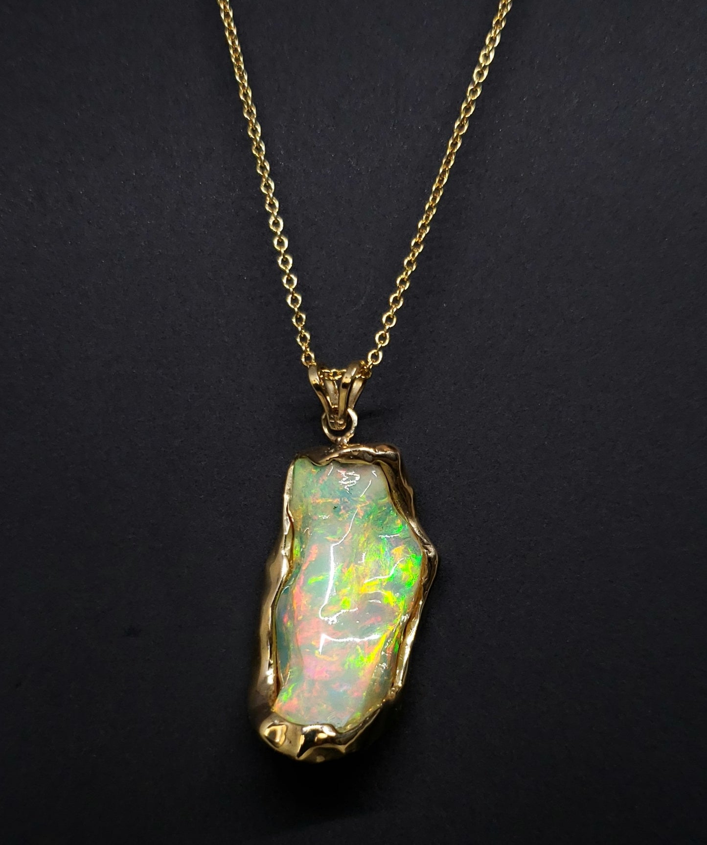 Carved Opal Gold Pendant